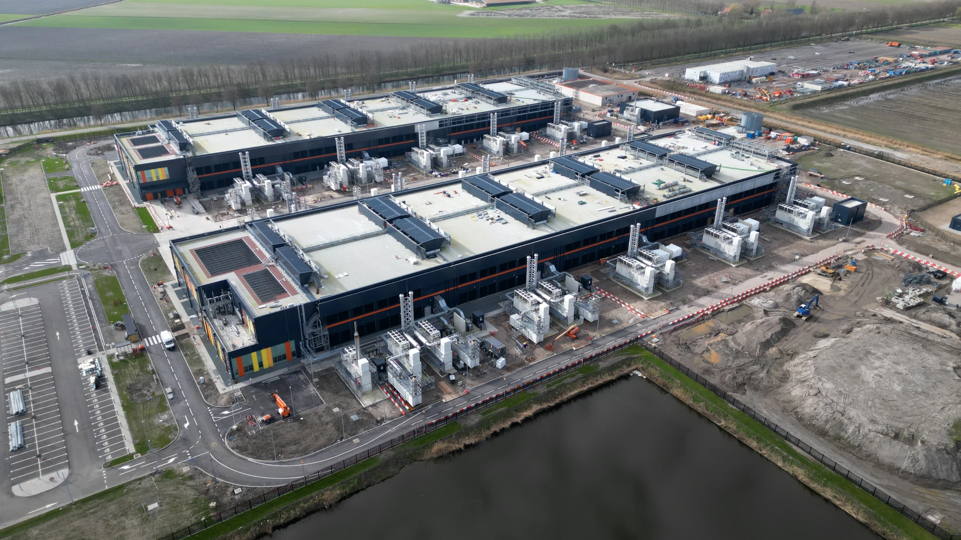 Hand picking up a plastic bottle on a beach